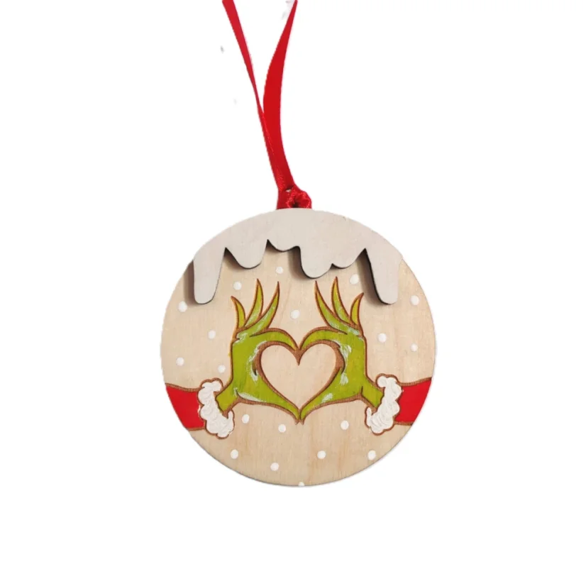 Vianočná guľatá ozdoba Grinch - jeho ruky zložené do tvaru srdca.
